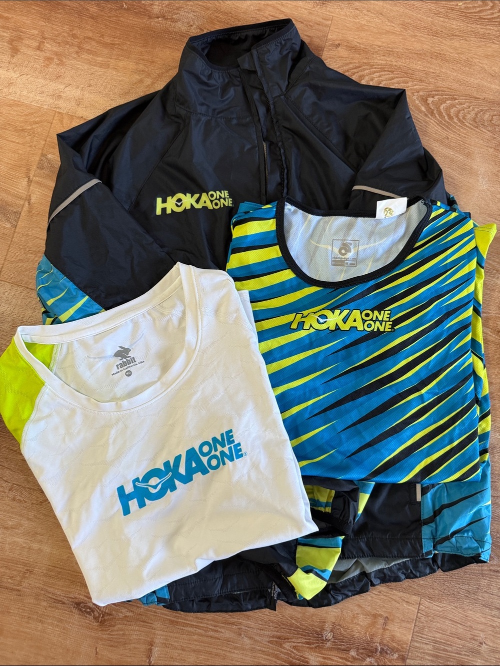 Hoka One One Women’s Black Jacket with Blue & Yellow Striped Top